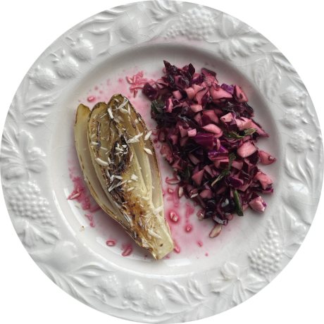 Endive and red cabbage on grape-relief plate
